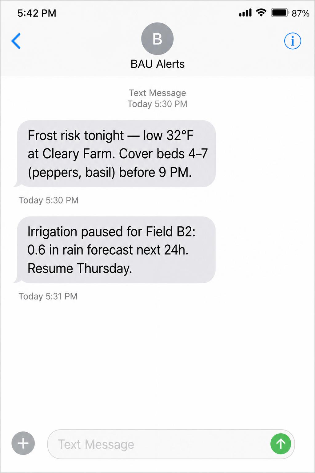 Smartphone screenshot of two SMS alerts from BAU Alerts about frost risk and paused irrigation.
